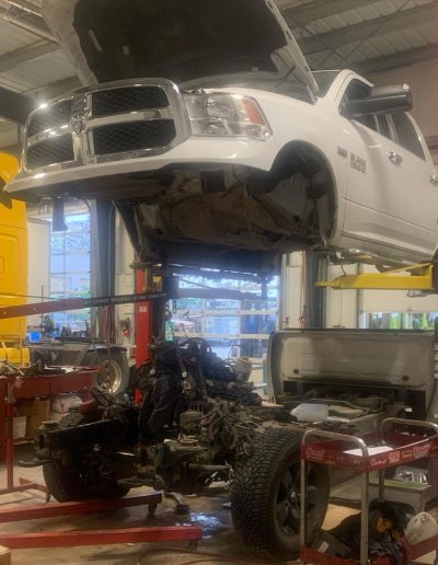 white-truck-on-hoist